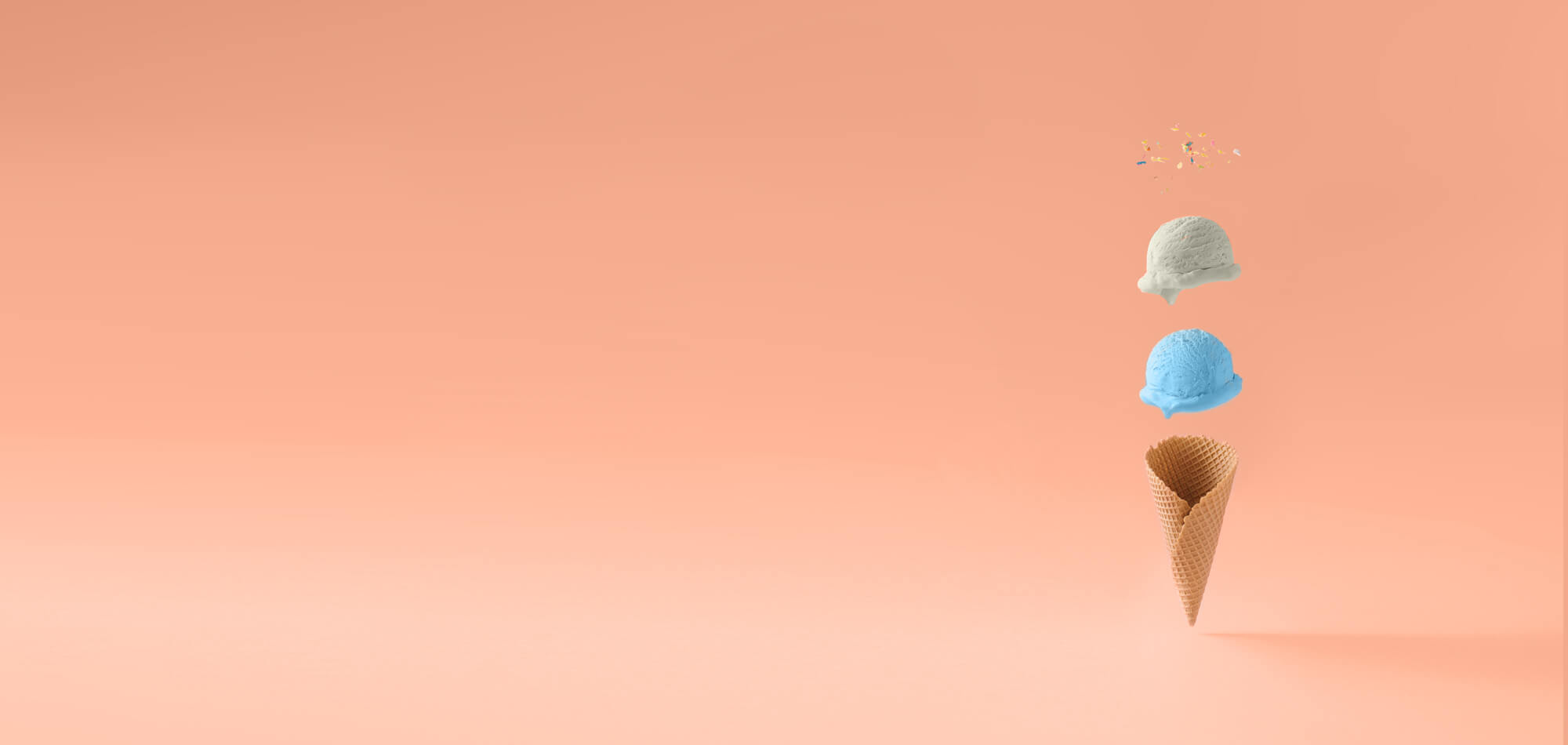 floating ice cream above cone on peach background
