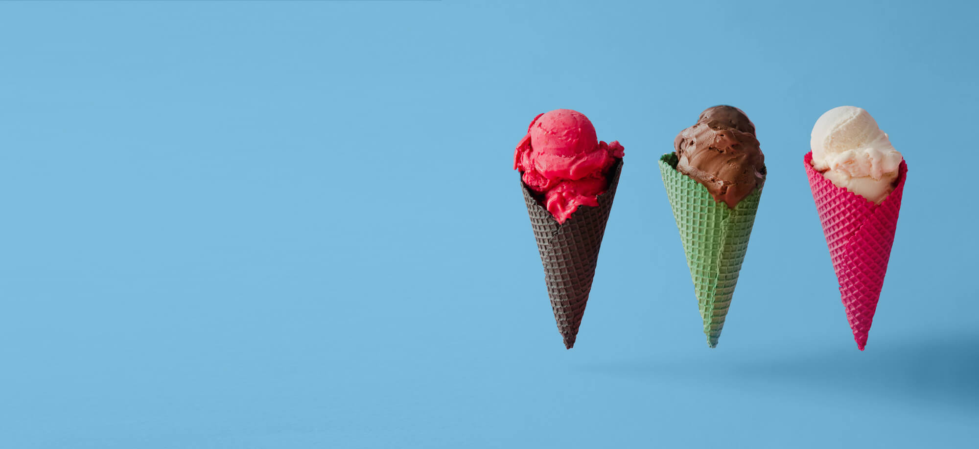 three ice cream cones floating
