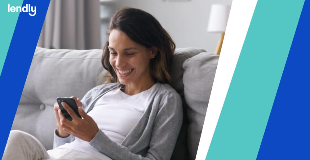 lendly woman sitting on couch with phone