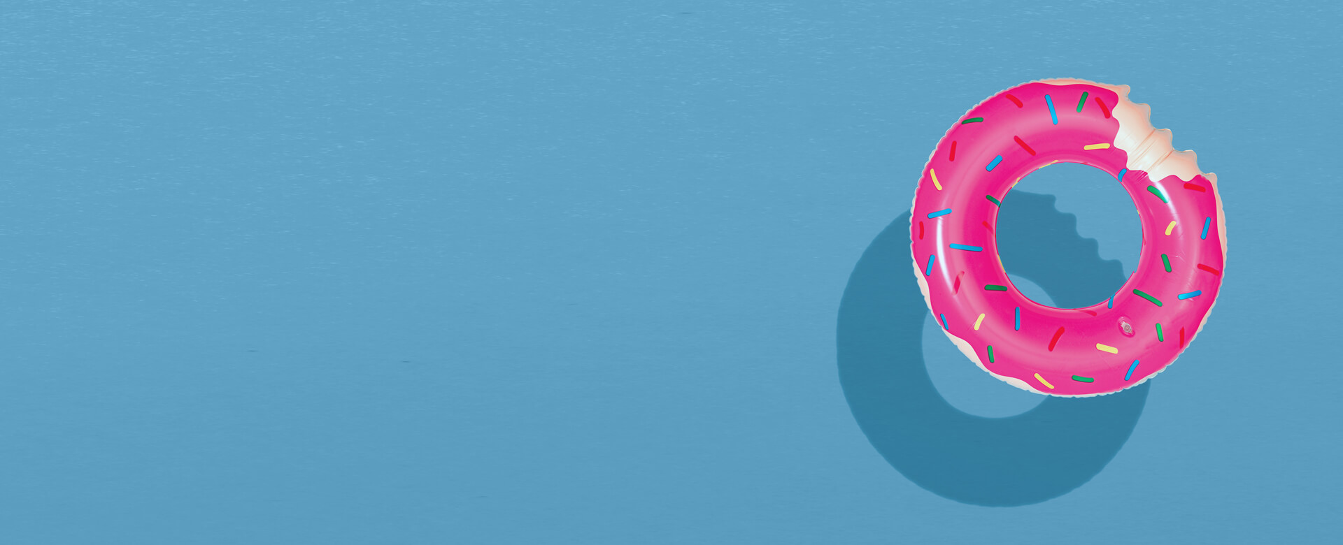 pool donut float on blue