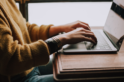 woman's hands on laptop